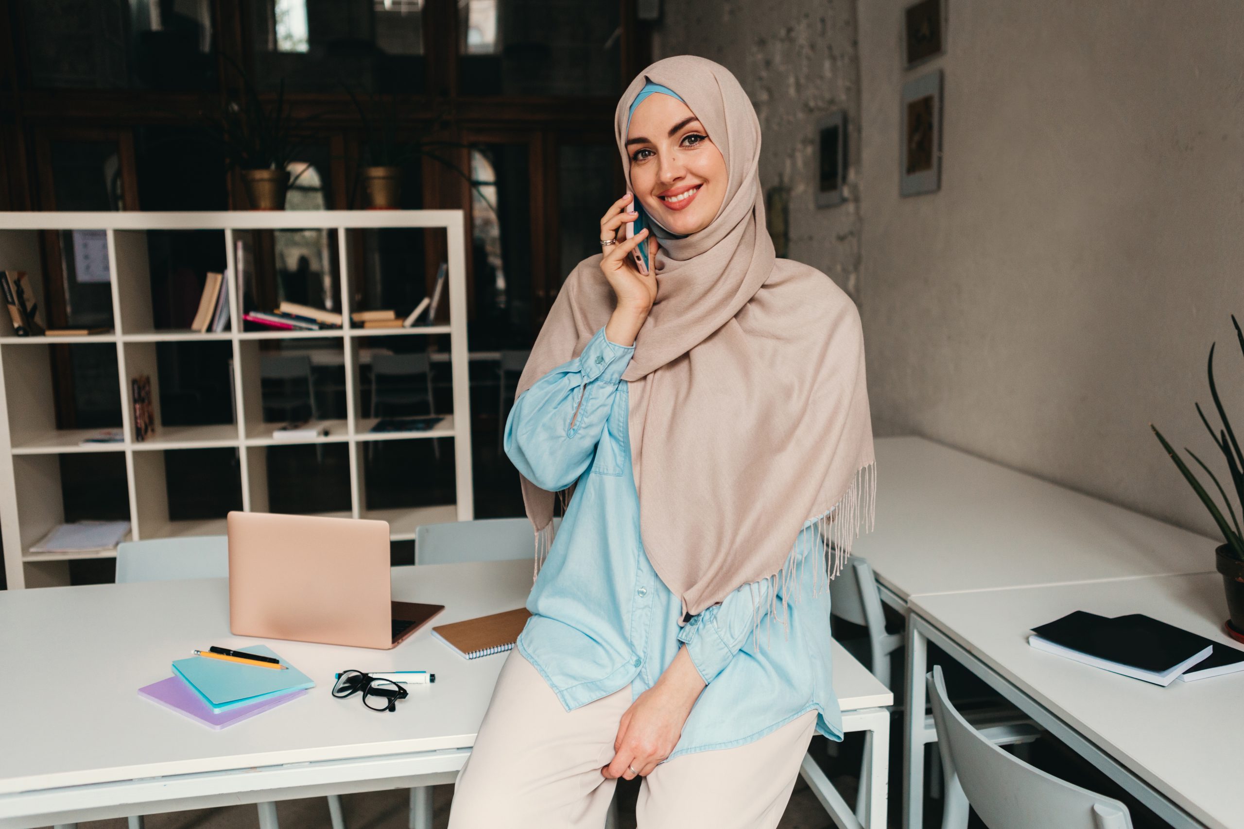 modern muslim woman in hijab in office room
